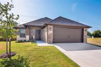 Beautiful brick home with stone accents and 2 car garage | Image 1