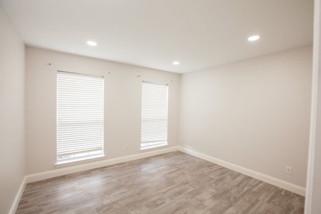 Empty room with light wood-type flooring and recessed lighting | Image 24