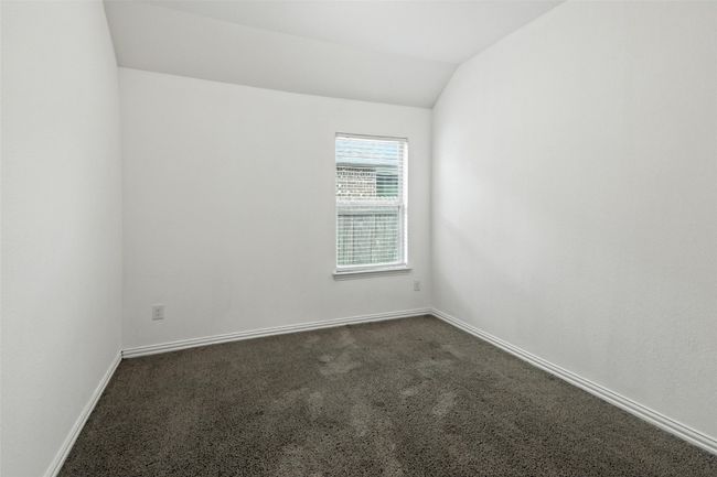 Spare room with dark carpet and vaulted ceiling | Image 16