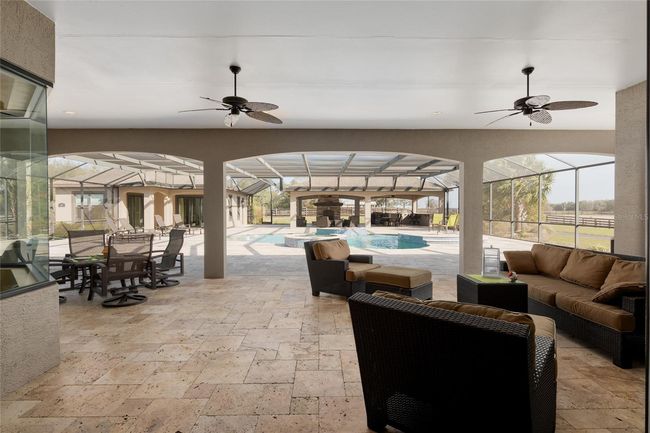 View of pool area looking out from living room | Image 60