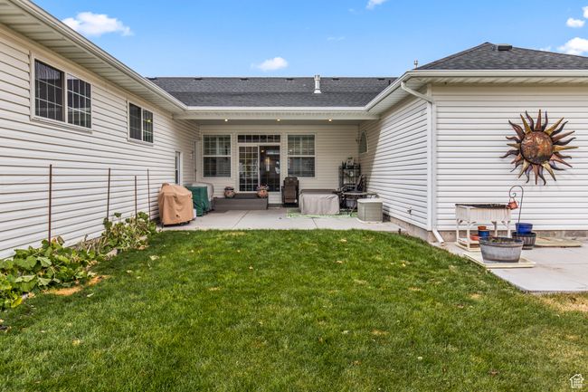 Back of property with a yard and a patio | Image 10
