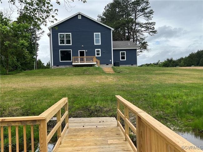 Rear view of house featuring a yard, crawl space, and a deck | Image 41