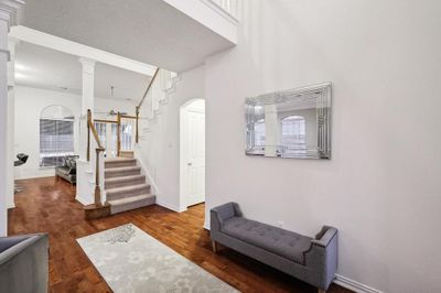 Foyer with a wealth of natural light and wood-type flooring | Image 3