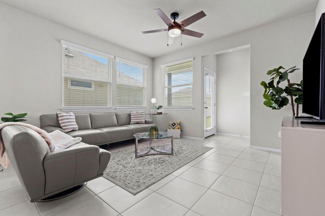 Living area featuring ceiling fan, baseboards, and light tile patterned floors | Image 6