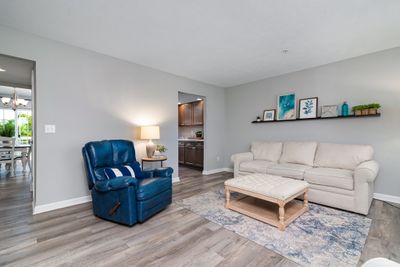 The Living room offers an abundance of natural light and a neutral decor | Image 3