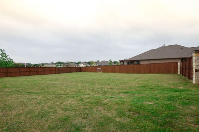 View of yard with a fenced backyard | Image 26