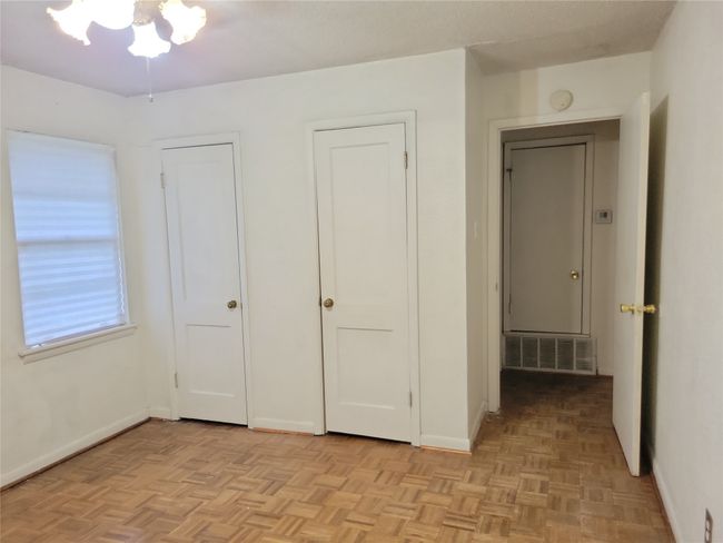 Unfurnished bedroom with baseboards | Image 13