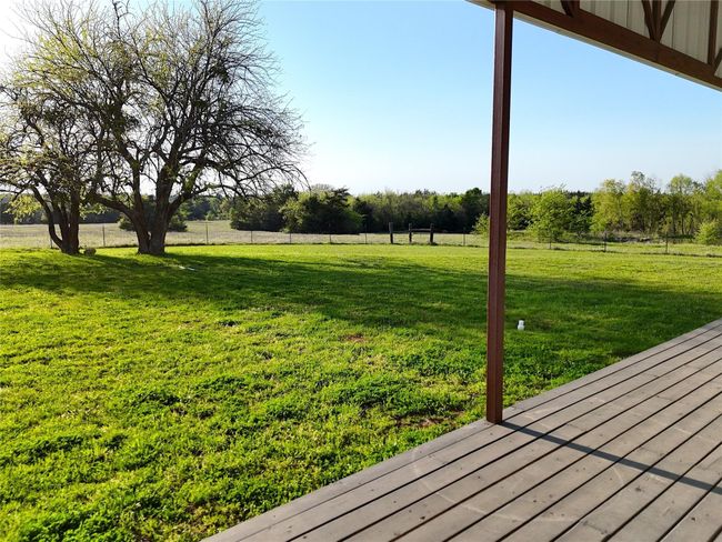 View of yard featuring a deck | Image 20