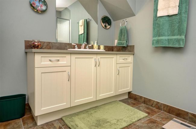 Lower level three piece bathroom with vanity and tile floors | Image 29
