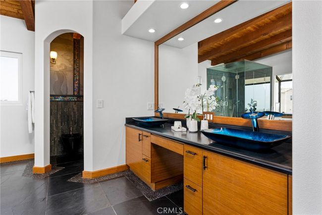 Thoughtfully designed for both style and function, this serene retreat offers a true spa-like experience. | Image 41