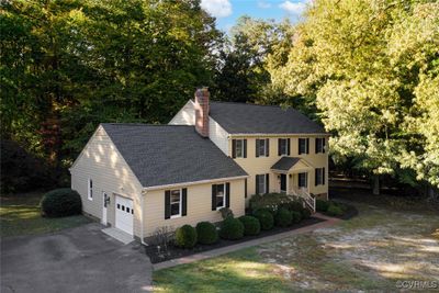 Home includes 2 car, side entry garage and loads of paved parking space | Image 2