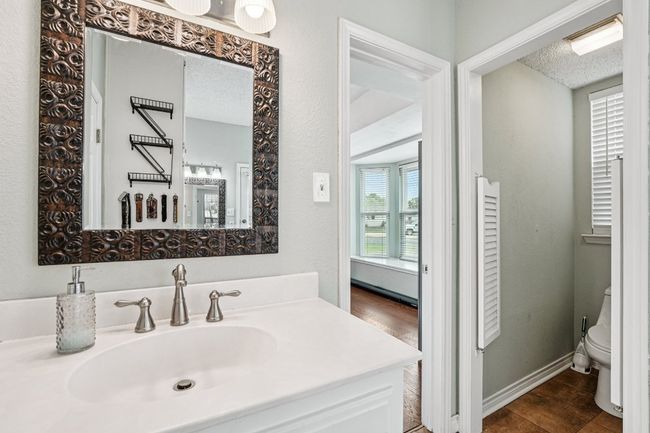 Bathroom with vanity, wood finished floors, and a textured ceiling | Image 17