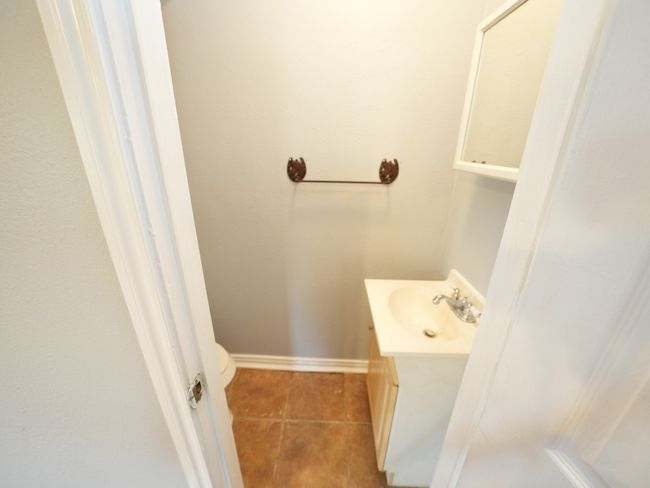 Bathroom with tile patterned flooring and vanity | Image 15