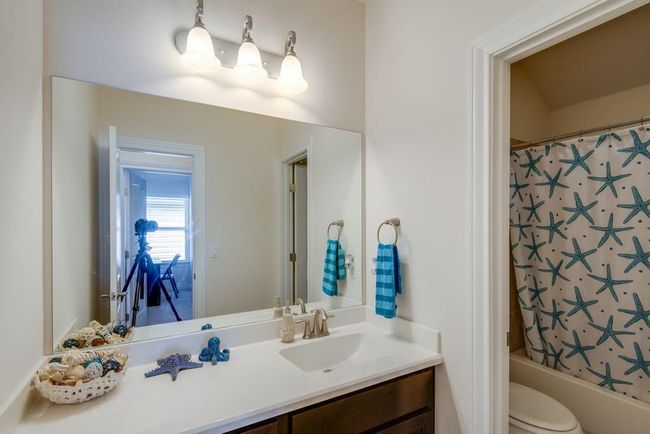 Full bathroom with toilet, shower / bath combo, and vanity | Image 24