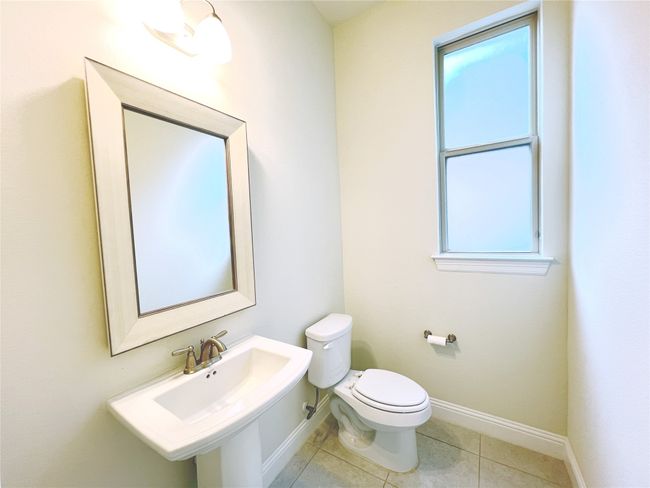 Bathroom with tile patterned flooring and healthy amount of natural light | Image 11
