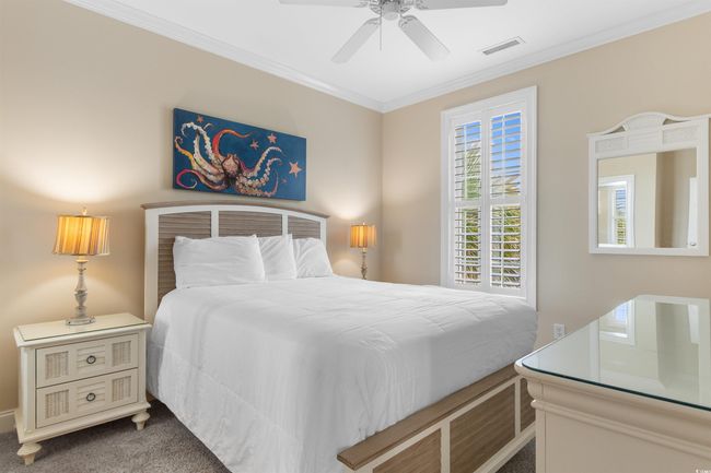 Bedroom with crown molding and a ceiling fan | Image 36
