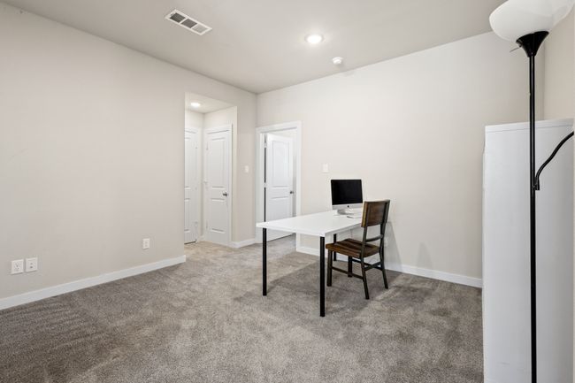 Carpeted home office with visible vents, recessed lighting, and baseboards | Image 20