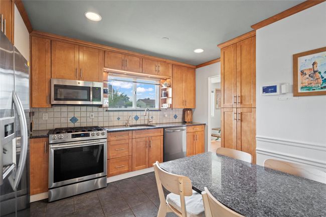 Bedroom featuring wood-type flooring and a ceiling fan | Image 17