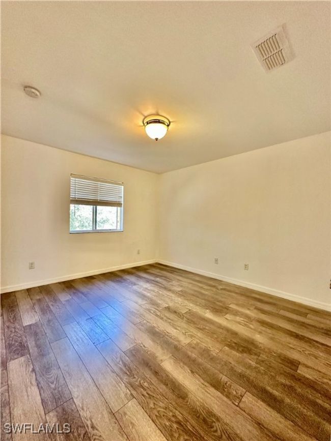 Unfurnished room with hardwood / wood-style flooring | Image 18