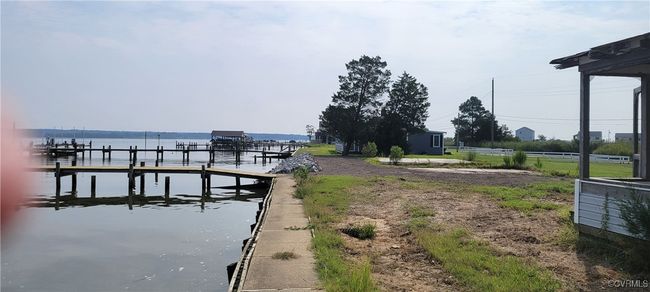 Dock area featuring a water view | Image 16