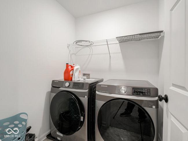 laundry room featuring laundry area and washer and clothes dryer | Image 48