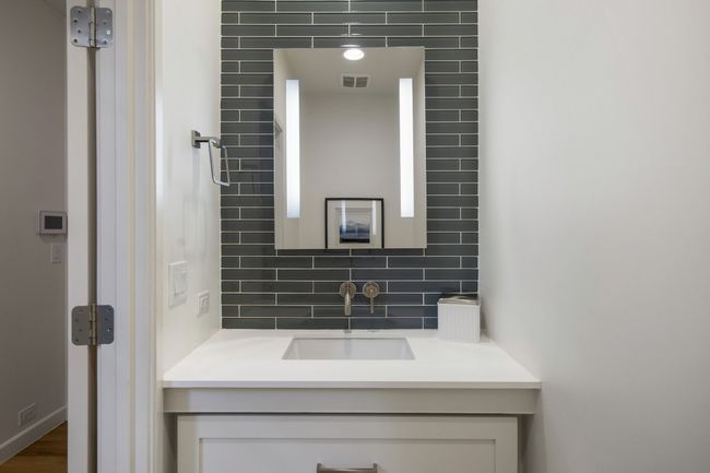 Bathroom featuring tasteful backsplash and vanity | Image 30