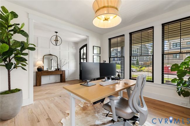 Home office featuring parquet flooring and a chandelier | Image 12
