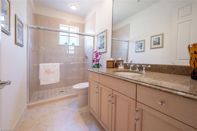 Bright guest bath with lots of cabinet space. | Image 37