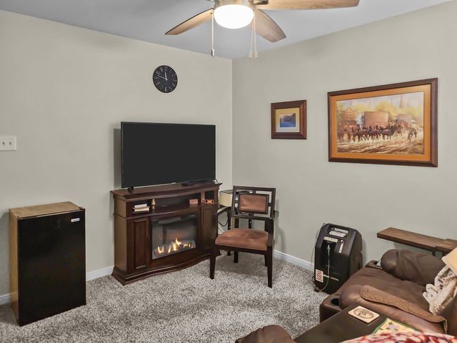 Carpeted bedroom 2 featuring a ceiling fan and baseboards | Image 27