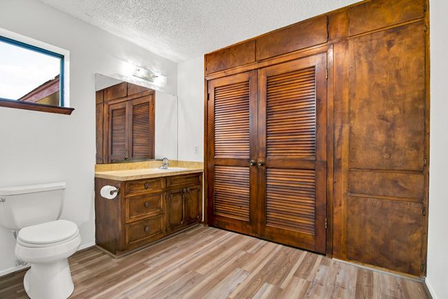 Primary bathroom has a second closet and pull out drawers. | Image 18