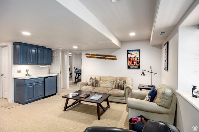 Living area with light carpet, and recessed lighting | Image 24