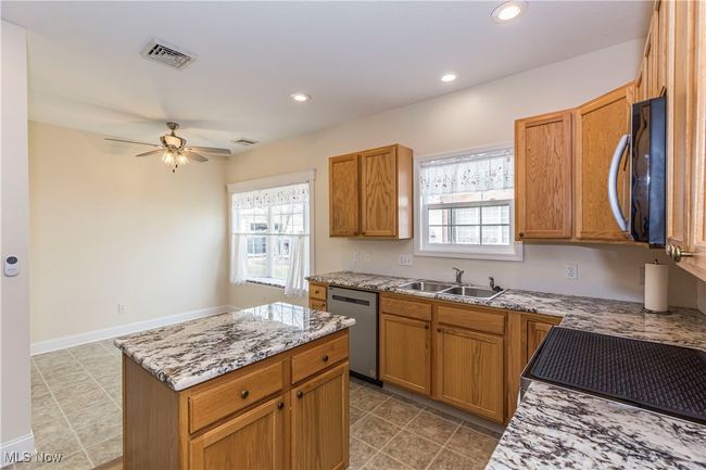 Kitchen with new appliances and new counter tops | Image 12