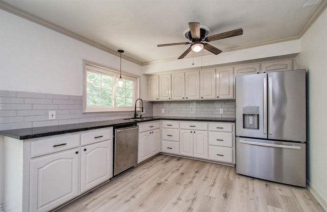 Remodeled kitchen includes refrigerator. | Image 14
