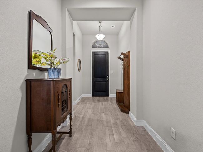 Entryway featuring light wood-style flooring and baseboards | Image 11