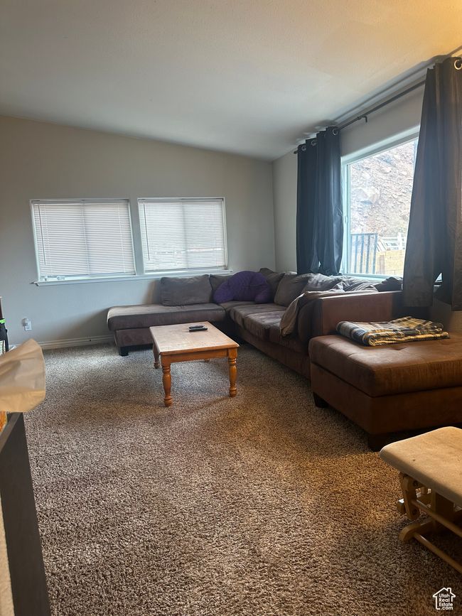 Living room featuring carpet and vaulted ceiling | Image 4