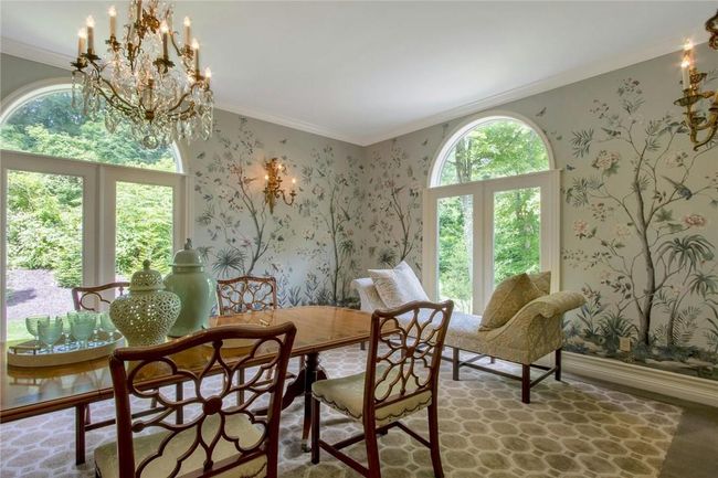 Dining area with crown molding, a wealth of natural light, and a chandelier | Image 13