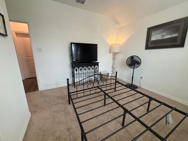 Carpeted bedroom with baseboards and vaulted ceiling | Image 17