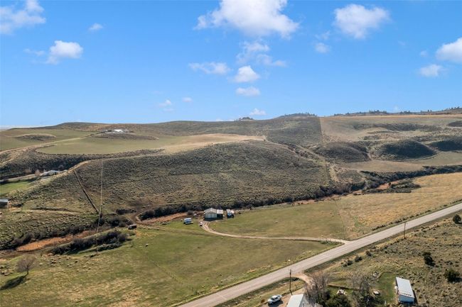 View of mountain backdrop with rural landscape | Image 6