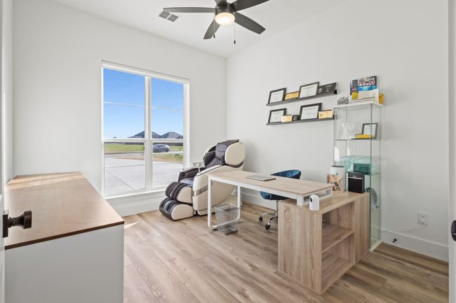 Office area featuring wood finished floors and ceiling fan | Image 15