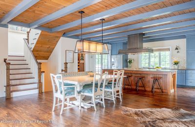 Great room with wet bar, mezzanine above | Image 3