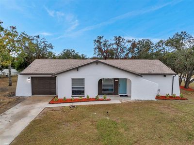 Charming Curb Appeal – Beautifully remodeled home on a spacious corner lot in Spring Hill. | Image 1