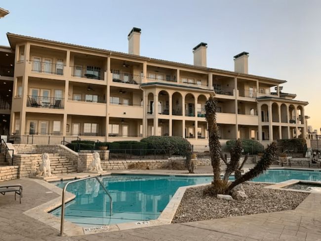 Community pool featuring a ceiling fan, a patio area, and stairs | Image 35