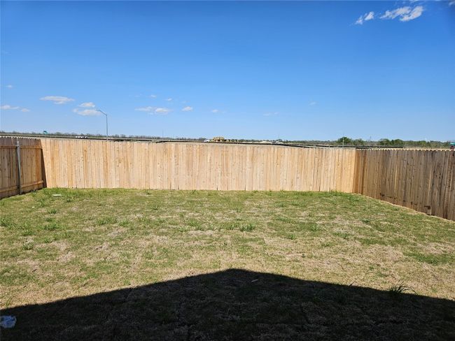 View of yard featuring a fenced backyard | Image 17
