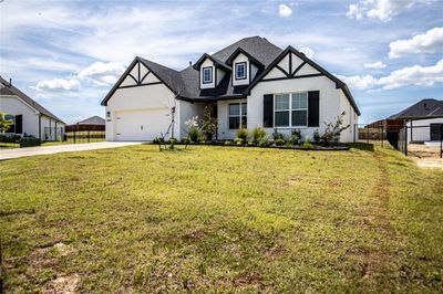 View of front of house featuring a garage and a front yard | Image 3