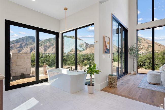 Dining area with a mountain view and tile patterned flooring | Image 44
