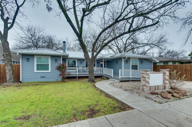 Single story home featuring crawl space, a standing seam roof, fence, metal roof, and a front lawn | Image 24