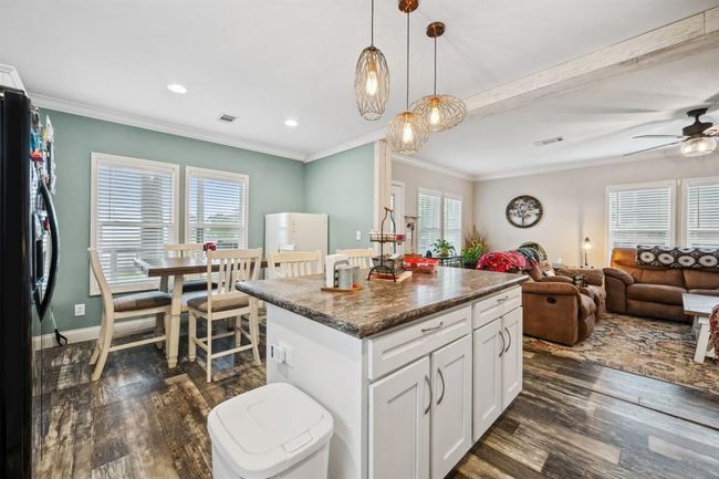 The island is great for a quick bite or offers additional counter space to make meal prep a breeze! | Image 13