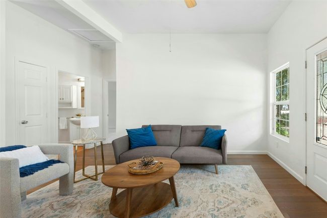 Living room with high ceilings, nice natural light and engineered hardwood floors | Image 4