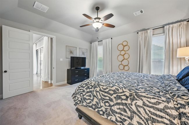 Carpeted bedroom with baseboards and a ceiling fan | Image 21