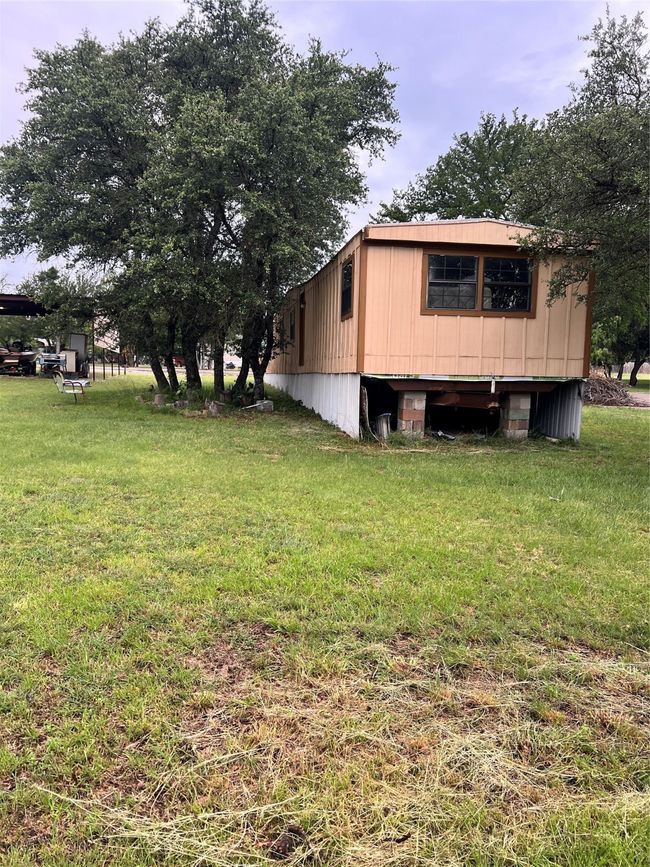 View of property exterior featuring a lawn | Image 10